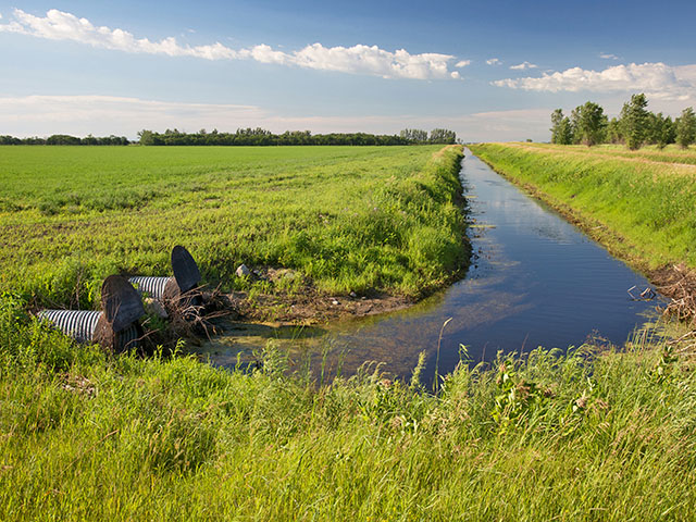 Tile drainage actually increases the ability of soil to store water before it runs off and reaches nearby rivers. (Progressive Farmer photo by David L. Hansen, Regents University of Minnesota)